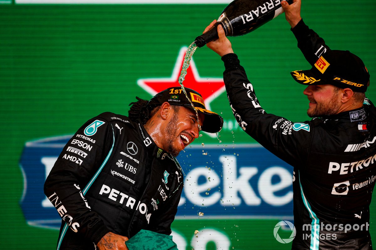 Valtteri Bottas, Mercedes, 3rd position, pours Champagne over Lewis Hamilton, Mercedes, 1st position, on the podium