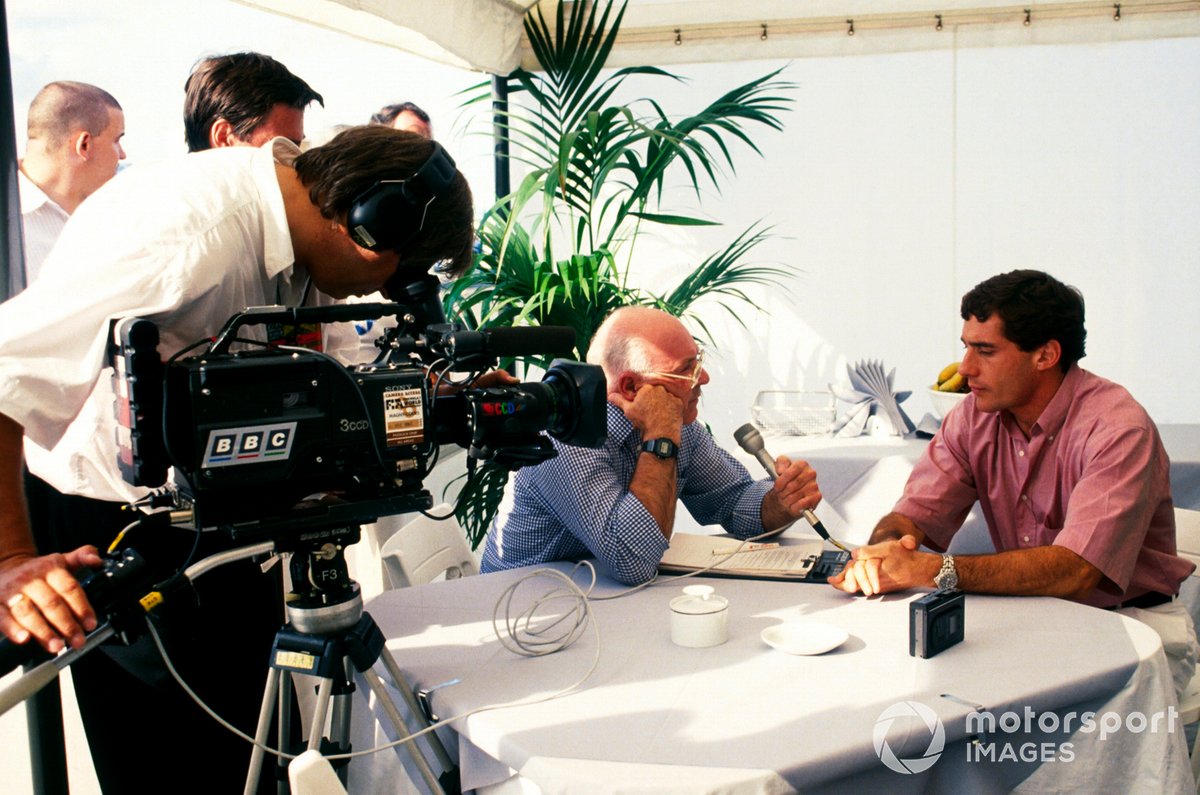 Ayrton Senna, McLaren, who crashed out on the opening lap of the race, is interviewed by Murray Walker, Television Commentator for the BBC.