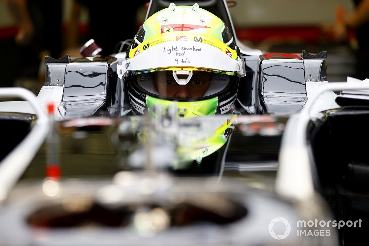 Mick Schumacher sits in his Haas VF-20 for his seat fitting.