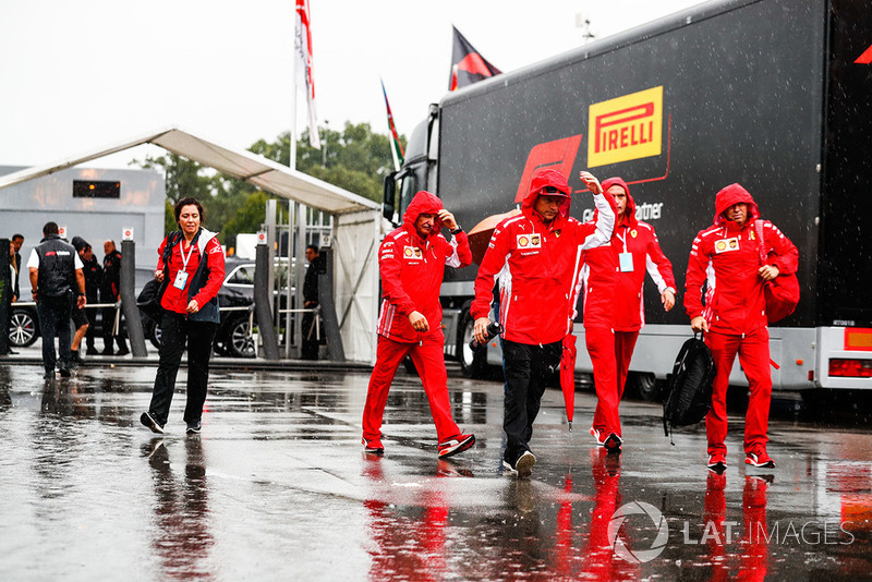Kimi Raikkonen, Ferrari, arrives in the paddock