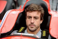 Fernando Alonso sits in the car of Marco Andretti