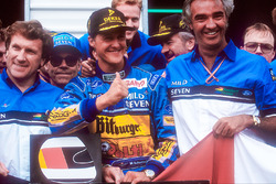 World Champion Michael Schumacher celebrates the Benetton team, Tom Walkinshaw and Flavio Briatore