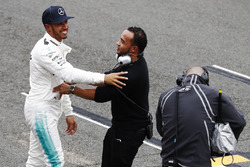 Lewis Hamilton, Mercedes AMG F1, is congratulated on his pole position by his brother Nick