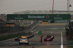 The drivers line up for the start and wait for the lights to go out