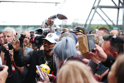 Lewis Hamilton, Mercedes AMG F1, takes a selfie for a fan