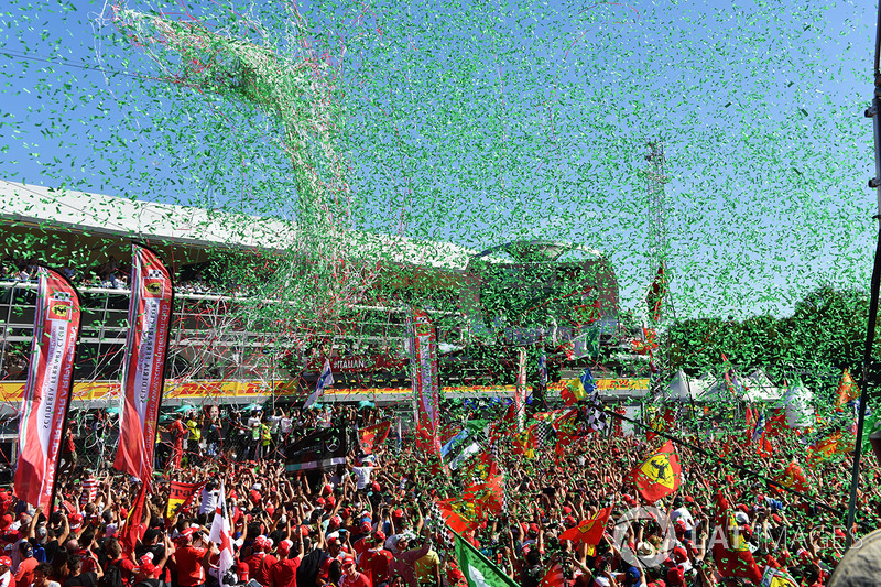 Fans and flags at the podium