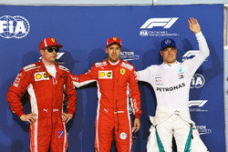 Kimi Raikkonen, Ferrari, pole sitter Sebastian Vettel, Ferrari and Valtteri Bottas, Mercedes-AMG F1 celebrate in parc ferme