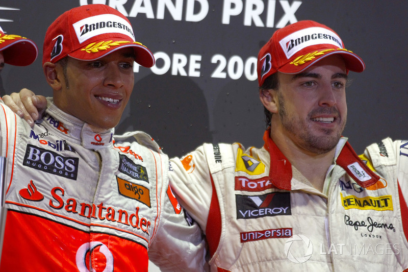 Lewis Hamilton, McLaren MP4-24 Mercedes and Fernando Alonso, Renault R29 celebrate on the podium