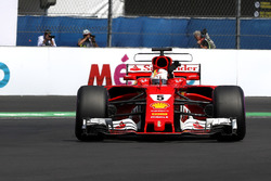 Pole sitter Sebastian Vettel, Ferrari SF70H celebrates and waves to the fans