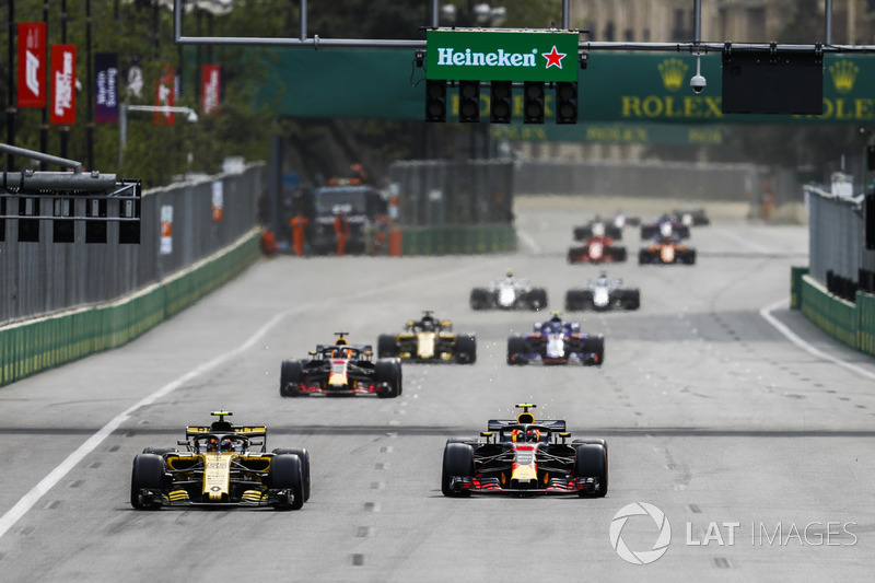 Carlos Sainz Jr., Renault Sport F1 Team R.S. 18, leads Max Verstappen, Red Bull Racing RB14 Tag Heuer, Daniel Ricciardo, Red Bull Racing RB14 Tag Heuer, and Nico Hulkenberg, Renault Sport F1 Team R.S. 18