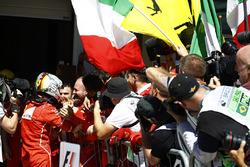 Sebastian Vettel, Ferrari SF70H, celebrates with his team after winning the race