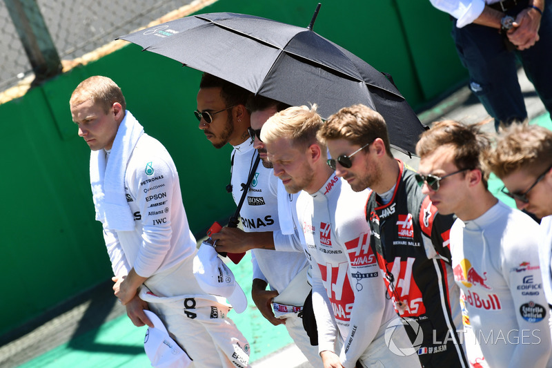 Drivers observe the National Anthem