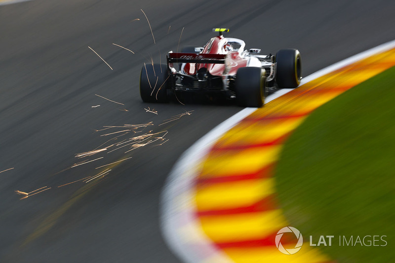 Sparks fly from the rear of Charles Leclerc, Sauber C37