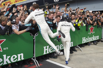 Lewis Hamilton, Mercedes AMG F1, and Valtteri Bottas, Mercedes AMG F1, celebrate in parc ferme