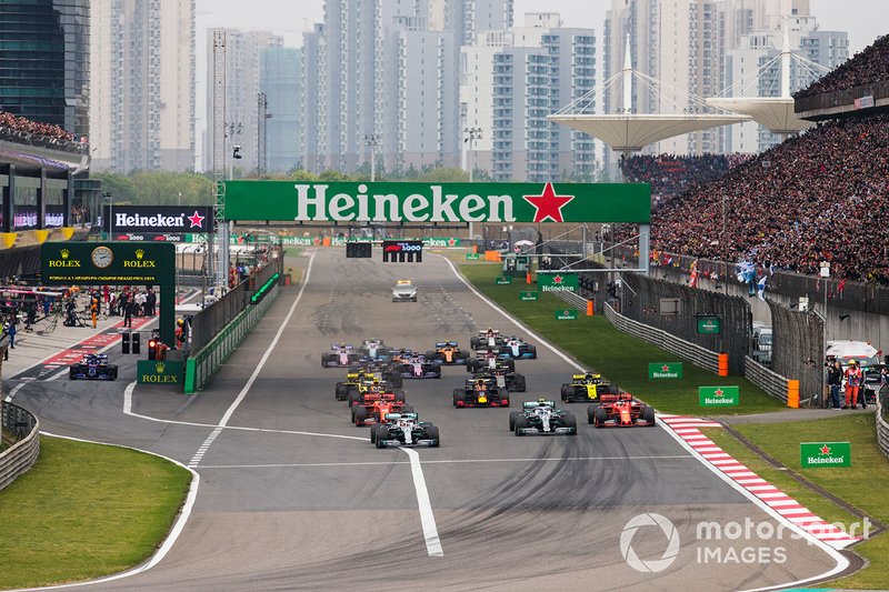 Lewis Hamilton, Mercedes AMG F1 W10, leads Valtteri Bottas, Mercedes AMG W10, Charles Leclerc, Ferrari SF90, Sebastian Vettel, Ferrari SF90, Max Verstappen, Red Bull Racing RB15, and the rest of the field towards the first corner