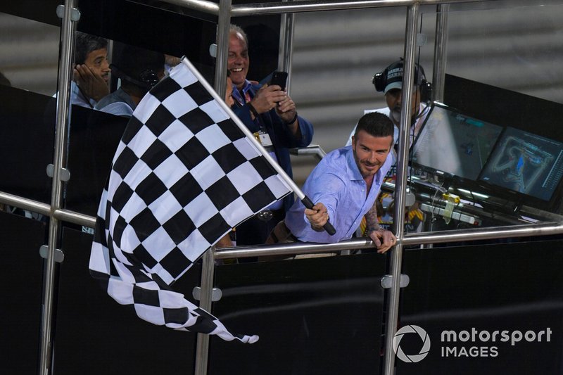 David Beckham waves the chequered flag