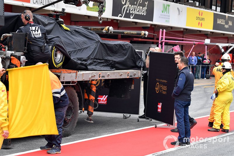 The car of Romain Grosjean, Haas F1 Team VF-19 is recovered to the pits