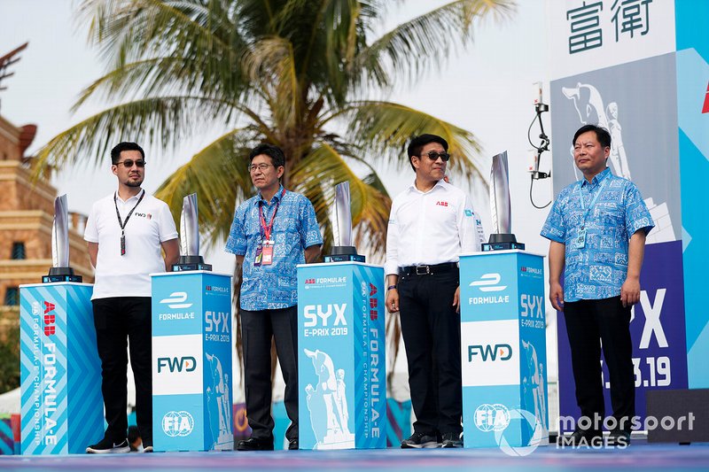 The trophies next to the dignitaries