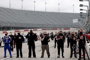 Teams members during the national anthem