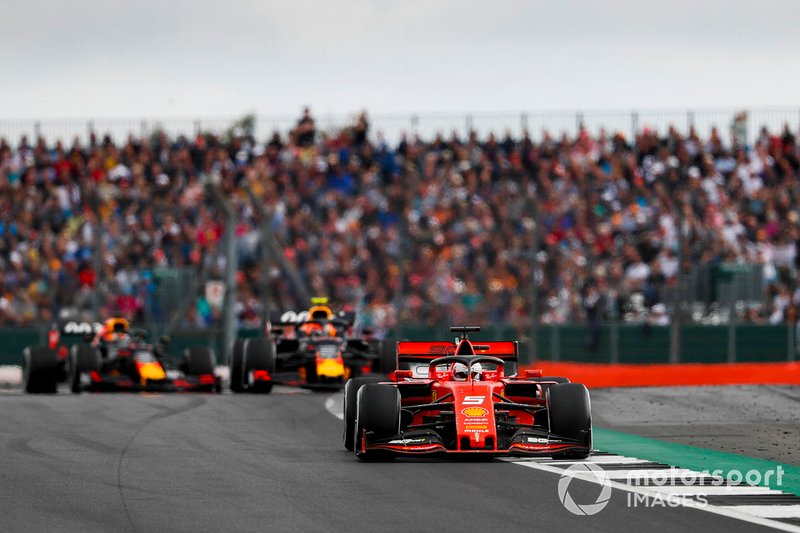 Sebastian Vettel, Ferrari SF90, leads Pierre Gasly, Red Bull Racing RB15