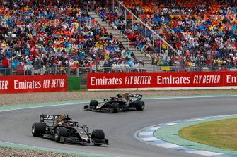 Romain Grosjean, Haas F1 Team VF-19, leads Kevin Magnussen, Haas F1 Team VF-19
