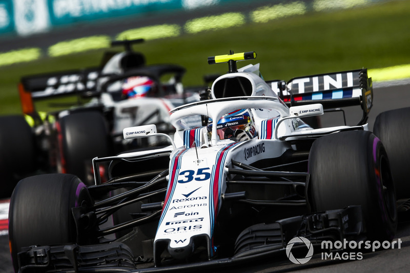Sergey Sirotkin, Williams FW41, leads Romain Grosjean, Haas F1 Team VF-18
