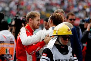 Sebastian Vettel, Ferrari, congratulates World Champion Lewis Hamilton, Mercedes AMG F1, in Parc Ferme