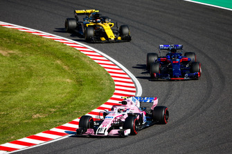 Esteban Ocon, Racing Point Force India VJM11, leads Brendon Hartley, Toro Rosso STR13, and Carlos Sainz Jr., Renault Sport F1 Team R.S. 18