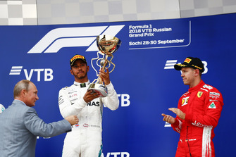 Vladimir Putin, President of Russia, presents Race winner Lewis Hamilton, Mercedes AMG F1, his trophy