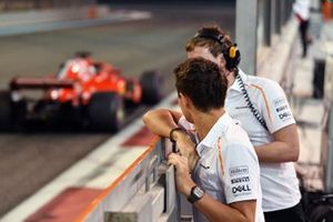 Lando Norris, McLaren watches Charles Leclerc, Ferrari SF71H