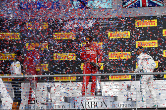 Max Verstappen, Red Bull Racing, Kimi Raikkonen, Ferrari and Lewis Hamilton, Mercedes AMG F1 celebrate on the podium with the champagne