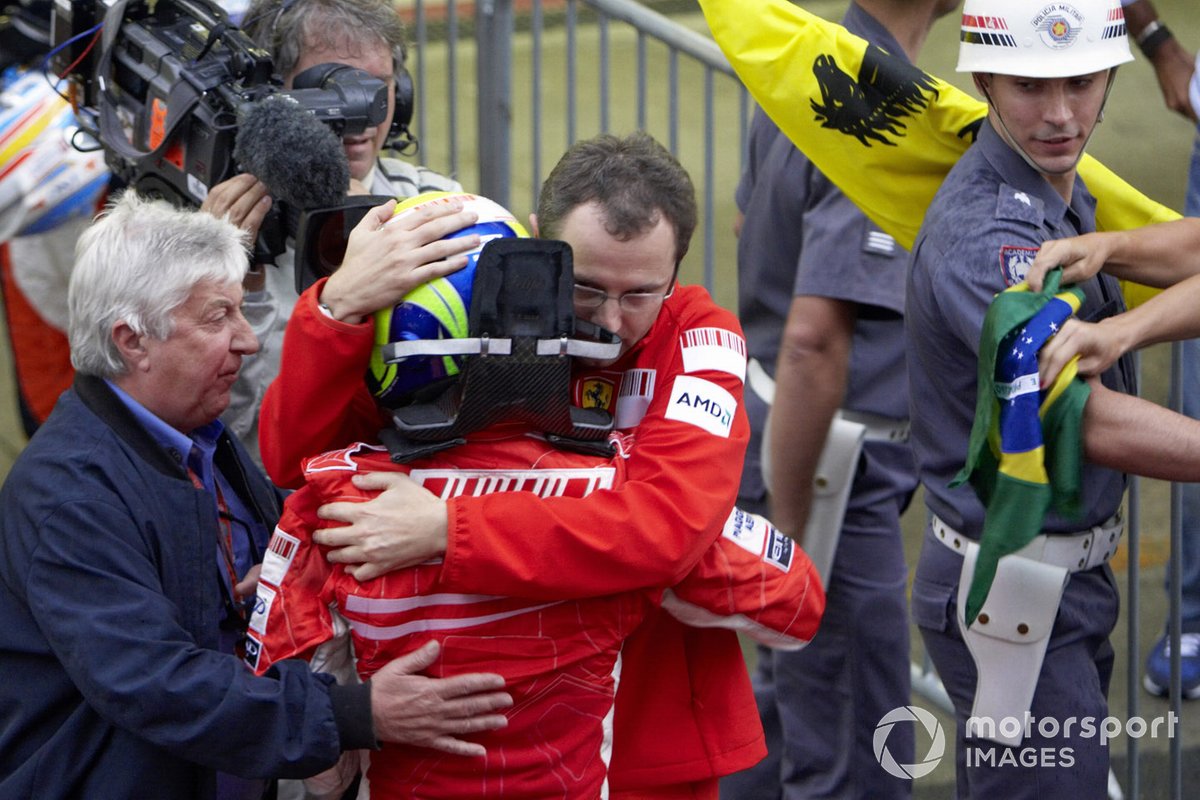 Ferrari's Stefano Domenicali and FIA race observer Herbie Blash console a Felipe Massa after the race