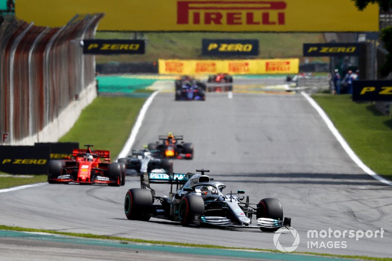 Lewis Hamilton, Mercedes AMG F1 W10, leads Sebastian Vettel, Ferrari SF90, and Valtteri Bottas, Mercedes AMG W10