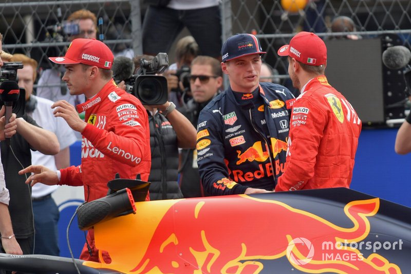 Charles Leclerc, Ferrari, pole man Max Verstappen, Red Bull Racing, and Sebastian Vettel, Ferrari, after Qualifying