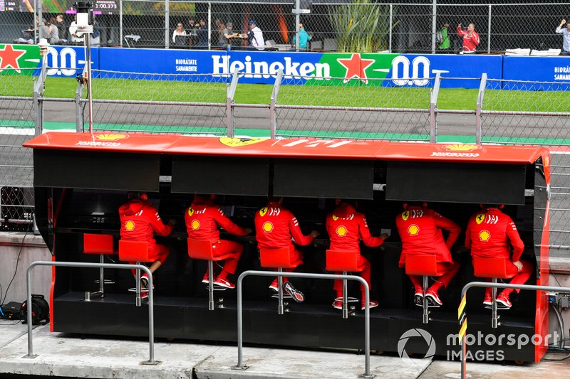 The Ferrari team on the pit wall