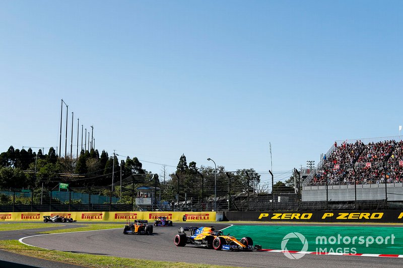 Carlos Sainz Jr., McLaren MCL34, leads Lando Norris, McLaren MCL34, Pierre Gasly, Toro Rosso STR14, and Romain Grosjean, Haas F1 Team VF-19, on the formation lap