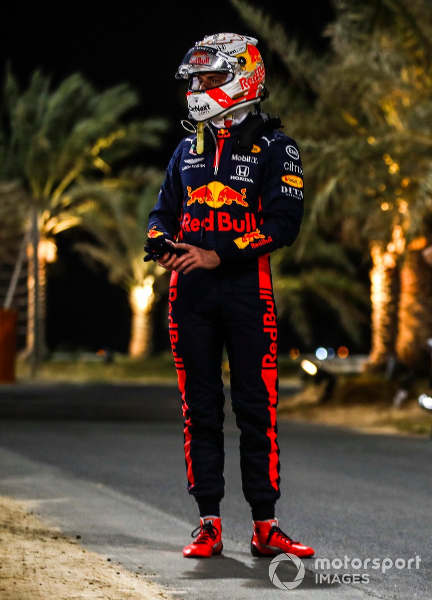 Max Verstappen, Red Bull Racing, stands by the side of the track after retiring