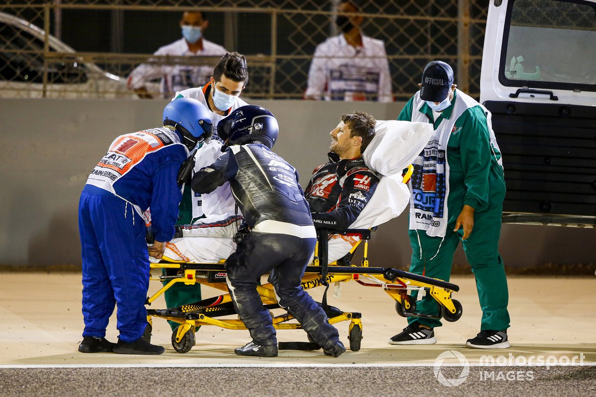 Romain Grosjean, Haas F1, is taken away on a stretcher after his opening lap crash