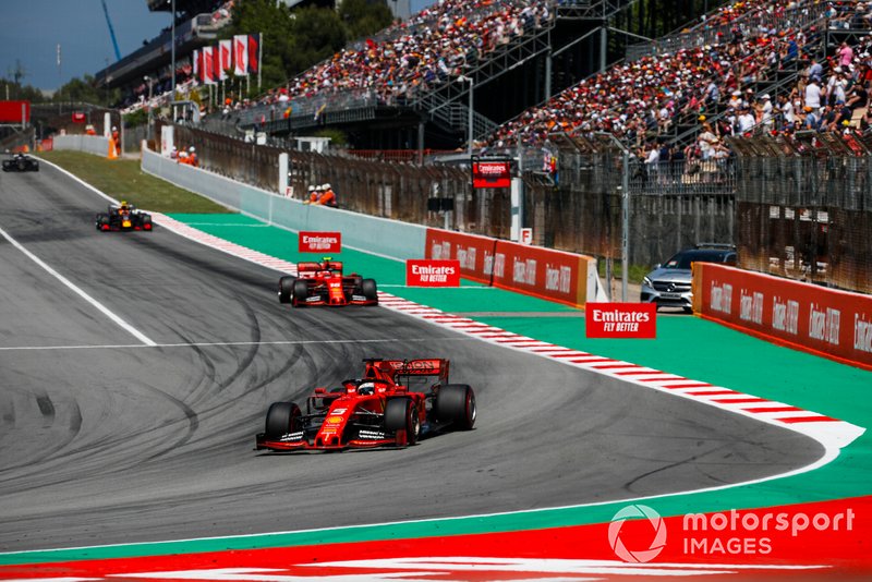 Sebastian Vettel, Ferrari SF90, leads Charles Leclerc, Ferrari SF90, and Pierre Gasly, Red Bull Racing RB15