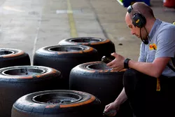A pirelli engineer checking tyre temperatures