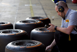 A pirelli engineer checking tyre temperatures