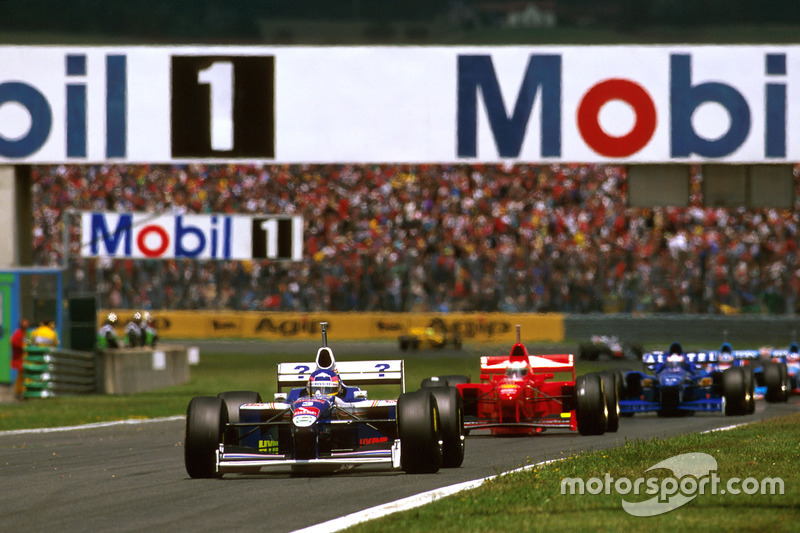 Jacques Villeneuve, Williams FW19 Renault leads Michael Schumacher, Ferrari F310B and Olivier Panis, Prost JS45 Mugen Honda