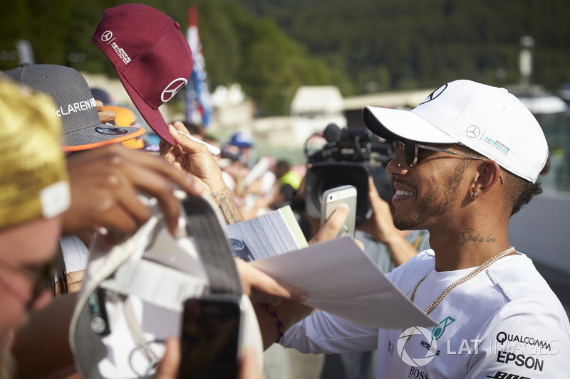Lewis Hamilton, Mercedes AMG F1, signs autographs for fans