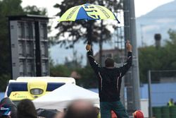 Rossi fan standing on the tyre wall celebrating Lorenzo's crash