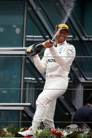 Lewis Hamilton, Mercedes AMG, sprays the victory Champagne