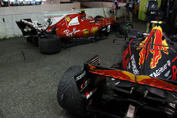 The damaged cars of Kimi Raikkonen, Ferrari SF70H and Max Verstappen, Red Bull Racing RB13 after colliding at the start of the race