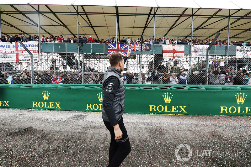 Stoffel Vandoorne, McLaren, waves to fans in a grandstand
