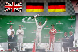 The podium (L to R): Lewis Hamilton, Mercedes AMG F1, second; Nico Rosberg, Mercedes AMG F1, race winner; Sebastian Vettel, Ferrari, third