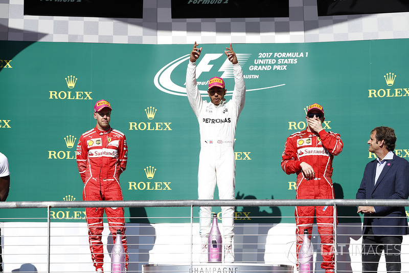 Race winner Lewis Hamilton, Mercedes AMG F1, second place Sebastian Vettel, Ferrari and third place Kimi Raikkonen, Ferrari