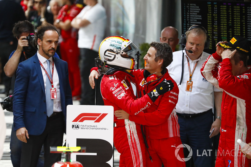 Race winner Sebastian Vettel, Ferrari, celebrates on arrival in Parc Ferme with Inaki Rueda, Race Strategist, Ferrari